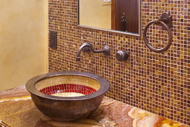 Inspiration for a multicolored tile and mosaic tile bathroom remodel in Boston with a vessel sink and beige walls