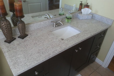 Photo of a bathroom in Toronto with granite benchtops.