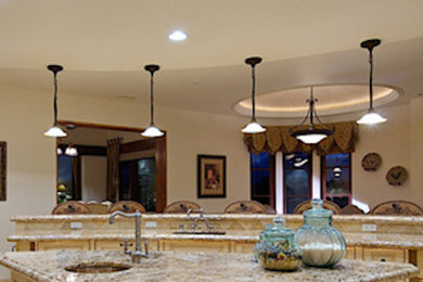 Kitchen photo in Richmond with granite countertops and beige backsplash