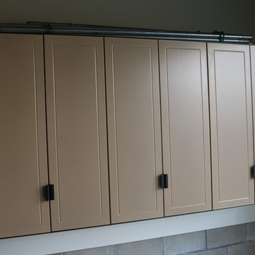 Deep, single wide garage features work bench and exercise area