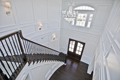 Staircase - huge traditional wooden curved mixed material railing staircase idea in Other with wooden risers