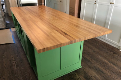 Large 1950s dark wood floor kitchen photo in Austin with shaker cabinets, white cabinets, wood countertops, an island and green countertops