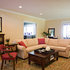 Traditional Living Room with Cream Sectional and Red Accents