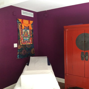 This is an example of a mid-sized study room in San Francisco with purple walls, dark hardwood floors, no fireplace and a freestanding desk.