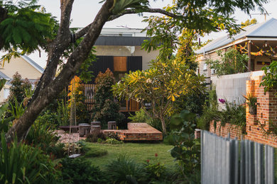 Inspiration for an eclectic garden in Brisbane with brick pavers.