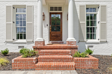 Entryway - traditional entryway idea in Atlanta with a dark wood front door