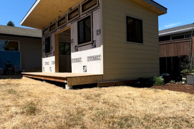 Mid-sized minimalist detached studio / workshop shed photo in Seattle
