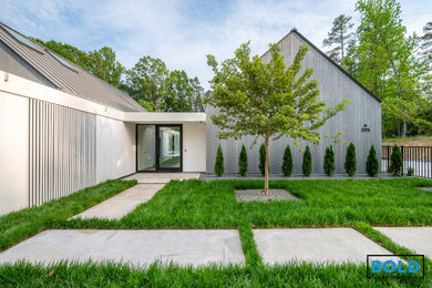 Inspiration for a large wood house exterior remodel in Charlotte