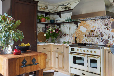 Example of a mid-sized tuscan marble floor and black floor enclosed kitchen design in Los Angeles with shaker cabinets, light wood cabinets, marble countertops, white backsplash, marble backsplash, white appliances and yellow countertops