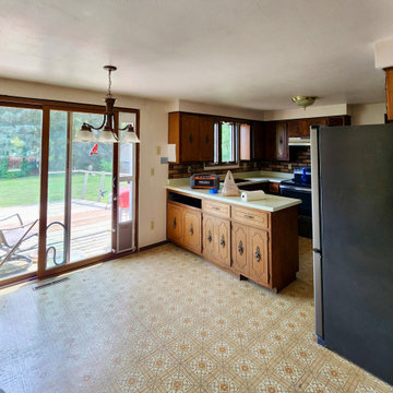 Photo 2 – Pre-Remodel Dining View Pre-renovation view of the kitchen and dining