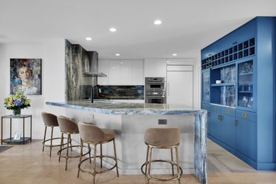 Example of a small minimalist u-shaped ceramic tile and gray floor eat-in kitchen design in Jacksonville with an undermount sink, flat-panel cabinets, white cabinets, blue backsplash, stainless steel appliances, an island, blue countertops and quartzite countertops
