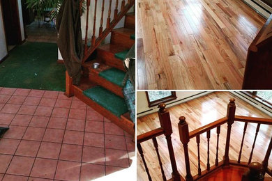 Example of a large medium tone wood floor foyer design in Other