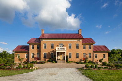 Large country multicolored two-story brick gable roof photo in Baltimore