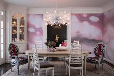 This is an example of a transitional separate dining room in Nashville with pink walls.