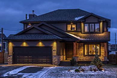 Mid-sized arts and crafts gray two-story wood exterior home photo in Other with a hip roof