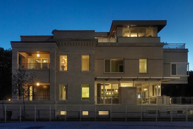 Inspiration for a large modern three-story brick exterior home remodel in Chicago