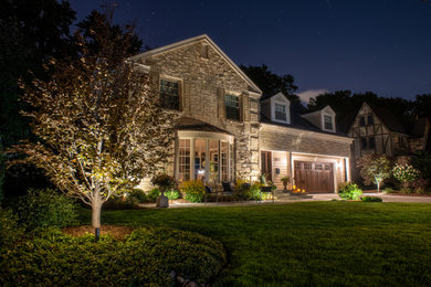 Photo of a mid-sized traditional full sun front yard stone walkway in Milwaukee for summer.
