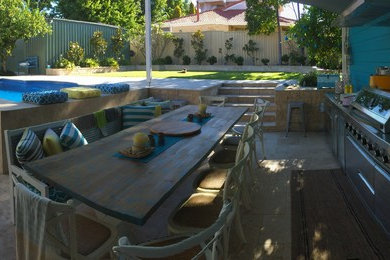Modern backyard garden in Perth with natural stone pavers.