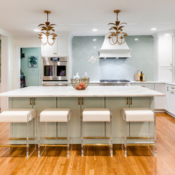 Elegant Kitchen Island with Seafoam Accents and Brass Details
