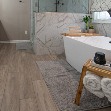 Traditional Master Bathroom With Warm Tones, Stand Alone Tub & Walk In Shower
