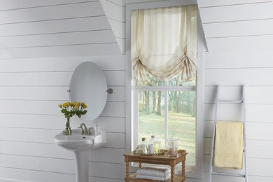 Bathroom - large transitional 3/4 light wood floor bathroom idea in Other with furniture-like cabinets, white walls and a pedestal sink