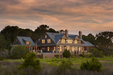 Inspiration for a large victorian brown two-story wood exterior home remodel in Charleston