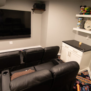 Basement Utilizing Open Space to Shoot Pool and Watch Favorite Sports Team