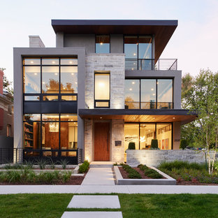 Mid-sized modern gray three-story stone exterior home idea in Denver