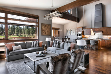 Large mountain style open concept medium tone wood floor living room photo in Sacramento with gray walls