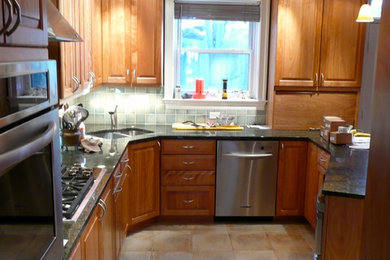 Inspiration for a transitional u-shaped ceramic tile eat-in kitchen remodel in DC Metro with an undermount sink, raised-panel cabinets, light wood cabinets, granite countertops, ceramic backsplash and stainless steel appliances