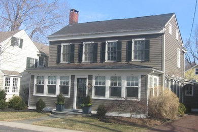 Mid-sized traditional brown two-story wood exterior home idea in Other