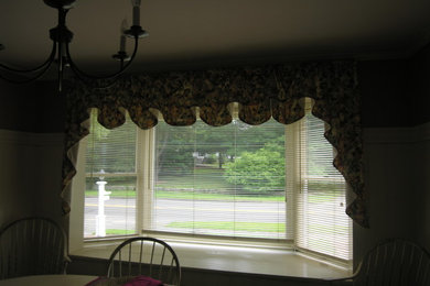 Mid-sized transitional dark wood floor kitchen/dining room combo photo in Boston with brown walls and a stone fireplace