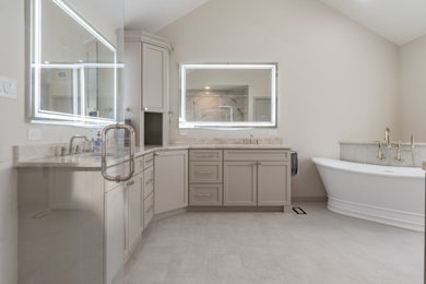 Large transitional master white tile and porcelain tile porcelain tile, beige floor and double-sink bathroom photo in Philadelphia with shaker cabinets, gray cabinets, a one-piece toilet, white walls, an undermount sink, quartz countertops, a hinged shower door, beige countertops and a built-in vanity