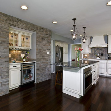 Dark Mahogany Wood Floor, Stone Wall, Bench Seat Bring Kitchen to Life
