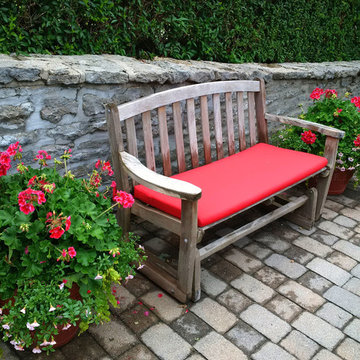 Red cushions revitalize garden benches and chairs