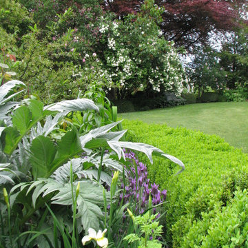 Lush Garden at Rosemound Farm in Portland Featuring Boxwood Hedges and Flowering