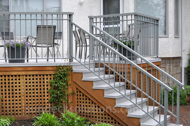 Inspiration for a transitional backyard deck remodel in Calgary with no cover