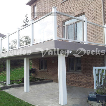 high level azek deck with glass railing