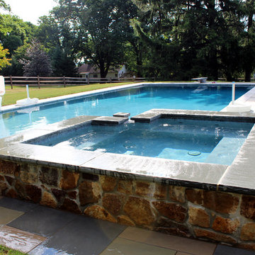 Lower Saucon Township custom rectangular pool with raised spa