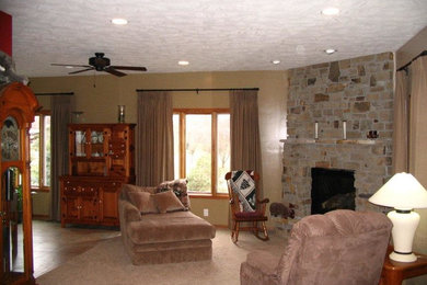 Living room - open concept carpeted living room idea in Other with beige walls, a ribbon fireplace, a stone fireplace and no tv
