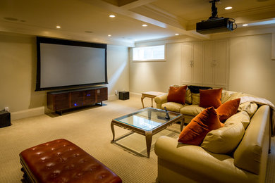 Photo of a large modern open concept home theatre in Calgary with beige walls, carpet, a projector screen and beige floor.