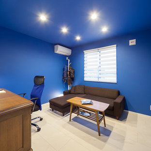 Design ideas for a modern home office and library in Other with blue walls and white floors.