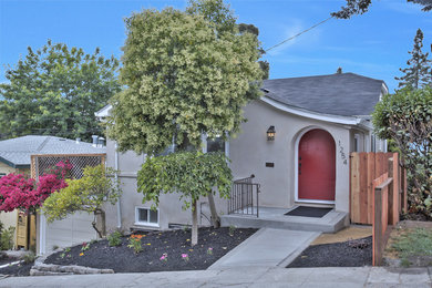 Mid-sized transitional gray one-story stucco house exterior photo in San Francisco