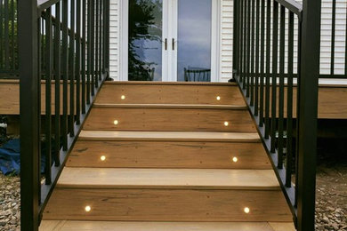 Deck - mid-sized traditional backyard deck idea in Other with no cover