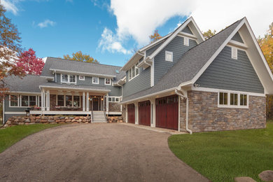 Inspiration for a large timeless blue two-story mixed siding gable roof remodel in Minneapolis