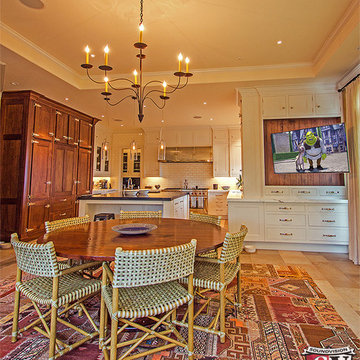 Kitchen with TV on motorized articulating arm