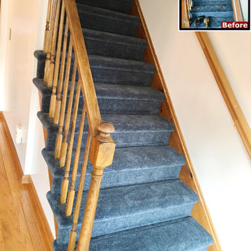 Staircase with navy blue carpet