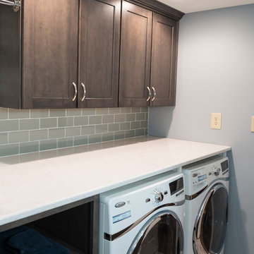 Laundry Room with Quartz Countertop and Glass Subway Tile Backsplash