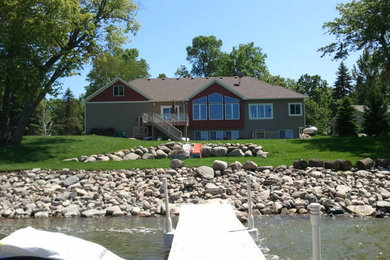 Home design - large craftsman home design idea in Minneapolis