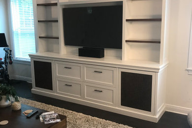 Example of a trendy family room design in Tampa with a music area and a media wall